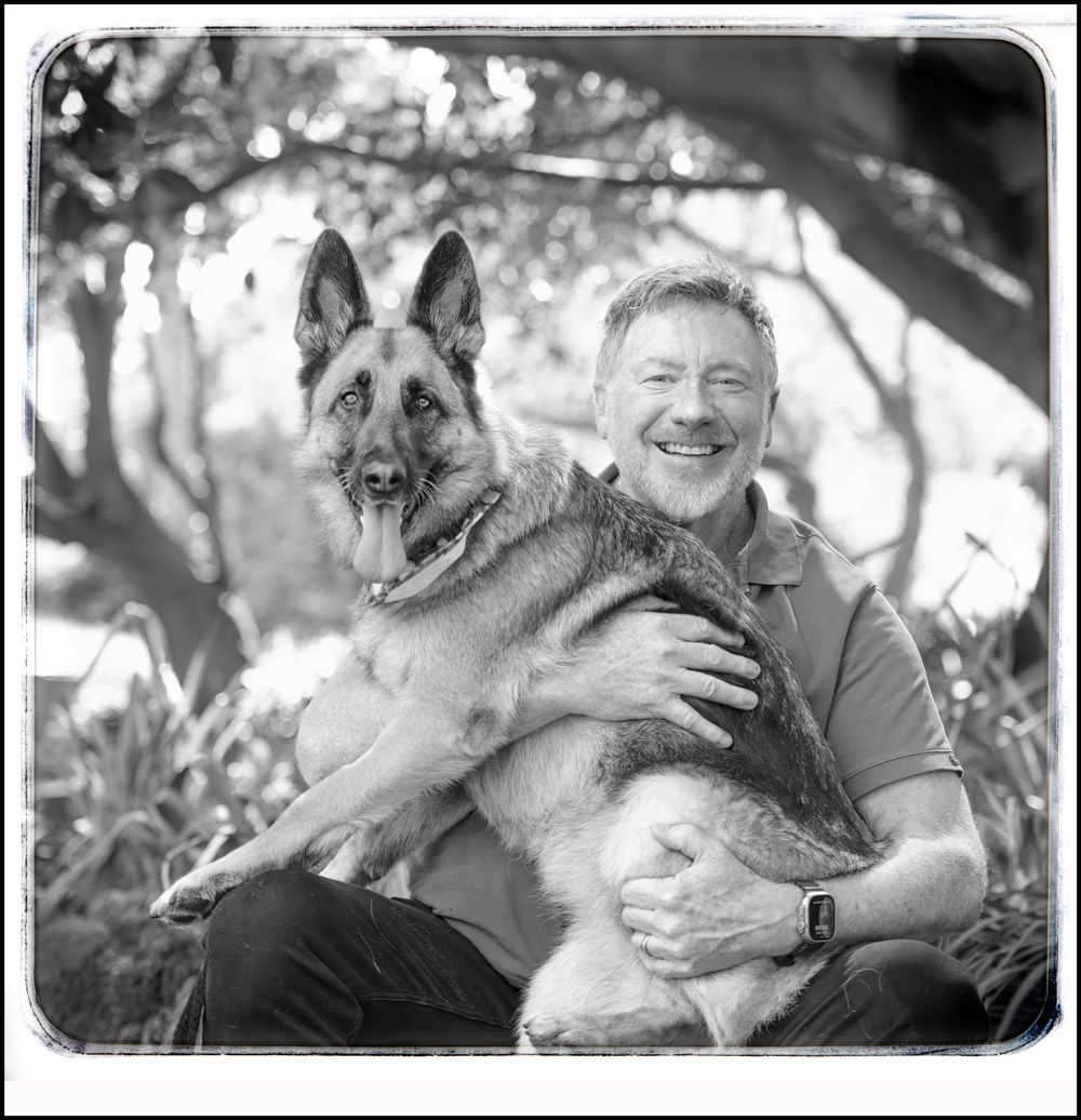 Simon Carroll with a German Shepherd